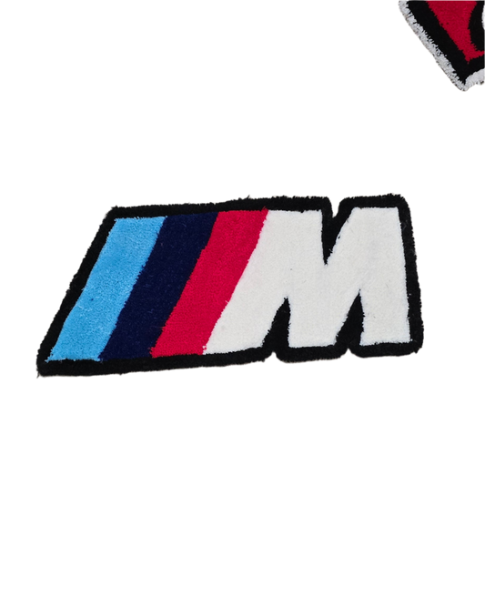 M badge rug